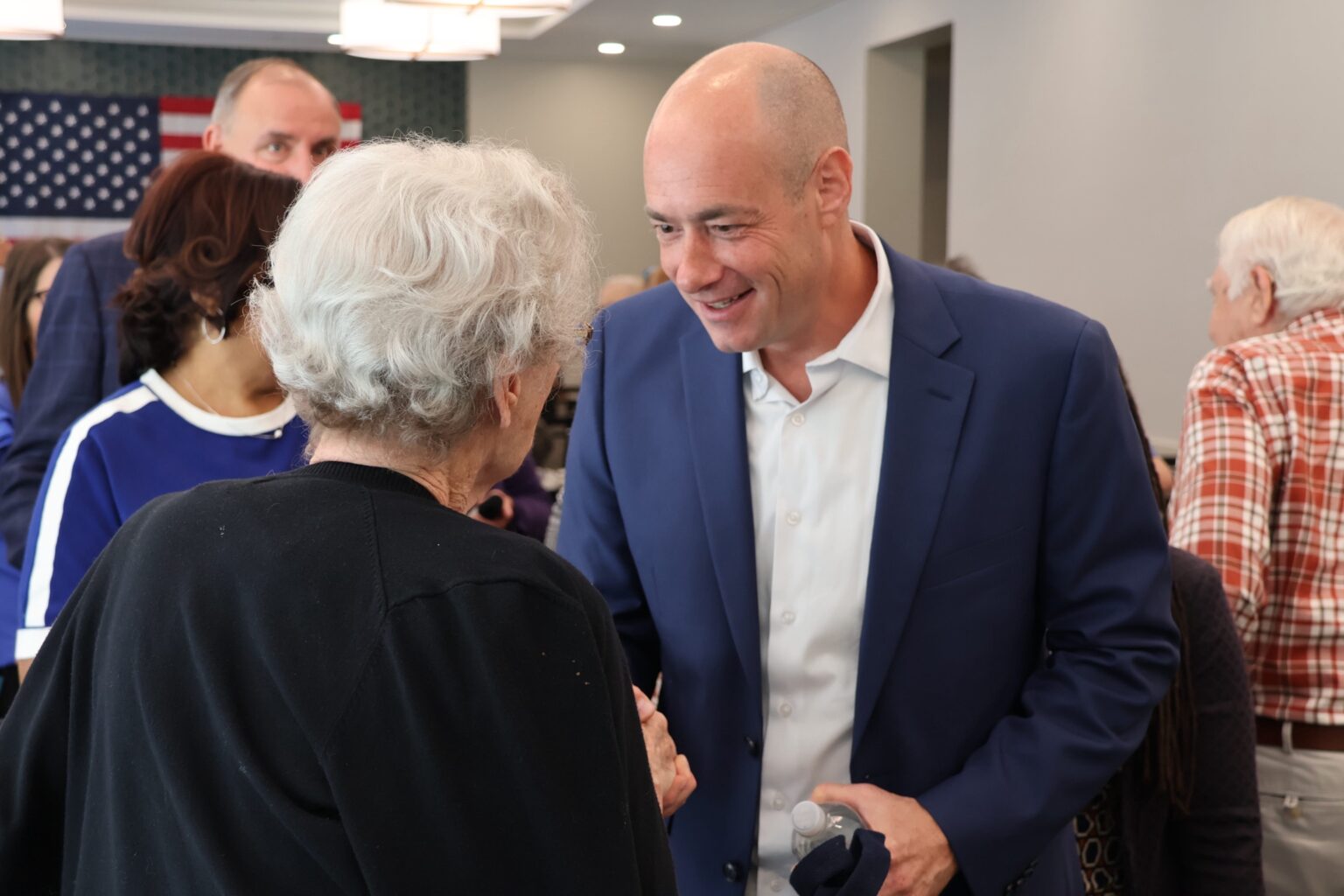 Landsman greeting an elderly woman