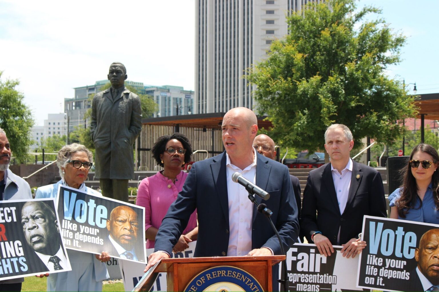 Landsman speaking at voting event