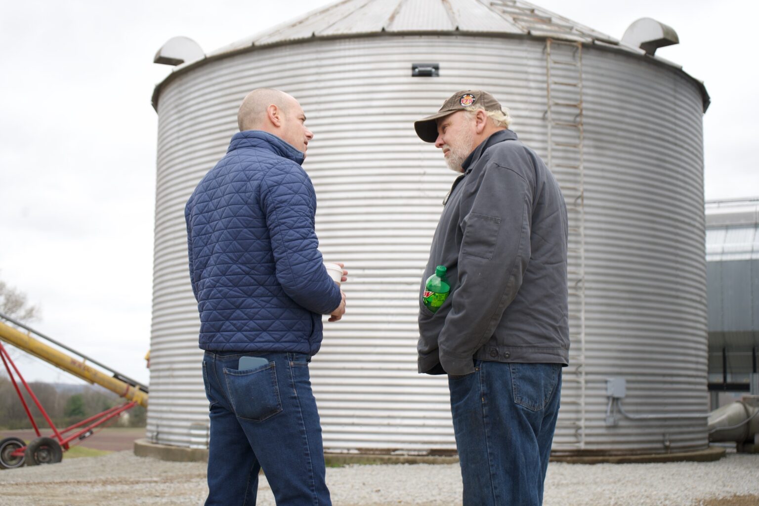 Landsman with gentleman outside corn mill