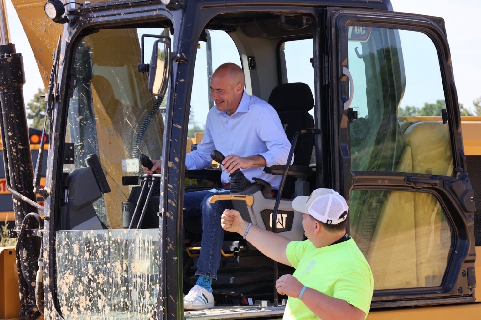 Landsman operating construction vehicle